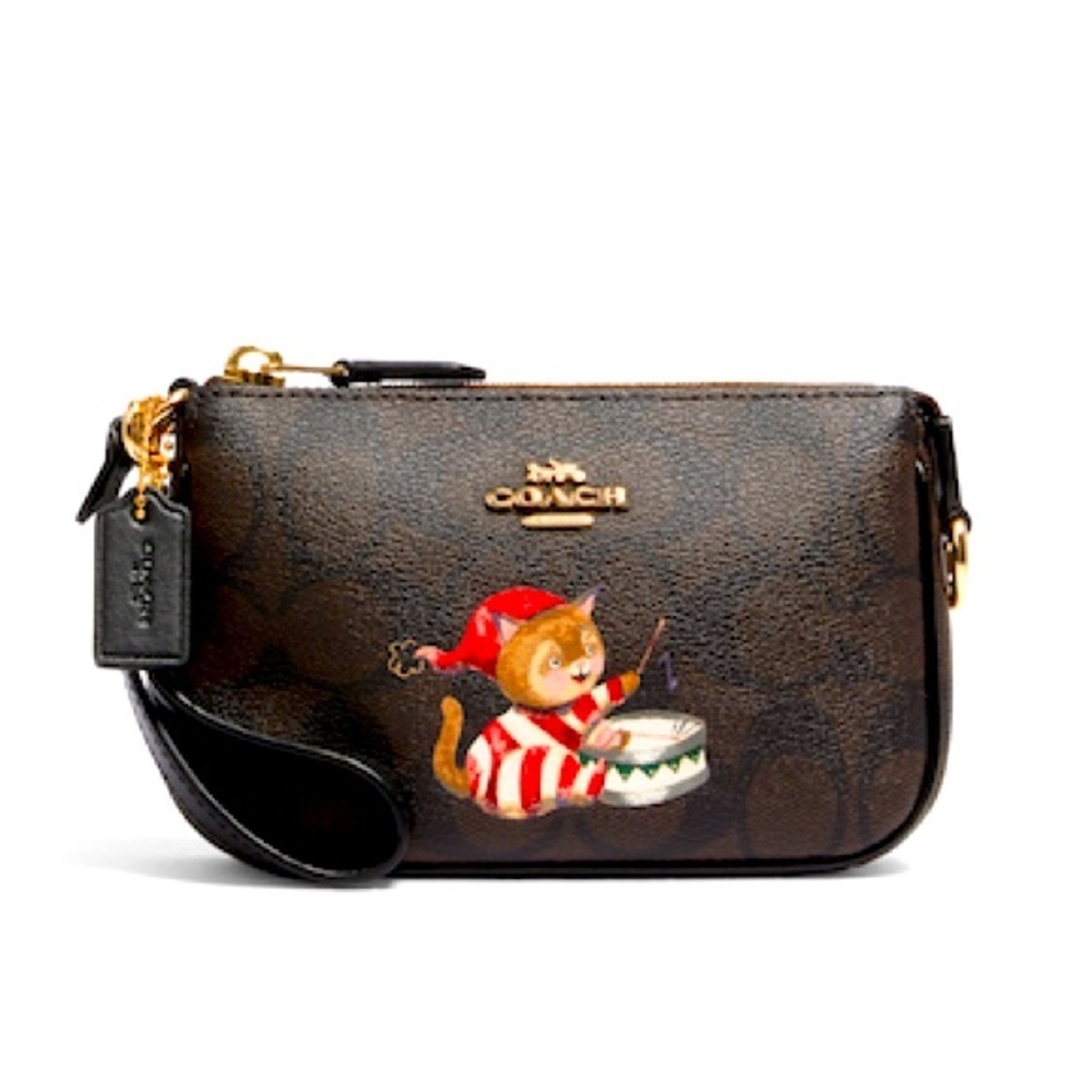***SOLD***Coach Nolita 15 signature canvas with cat and wirstlet